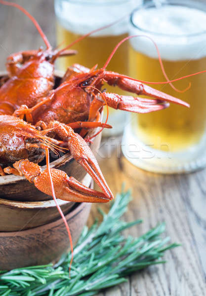 Bowl of boiled crayfish with two mugs of beer Stock photo © Alex9500