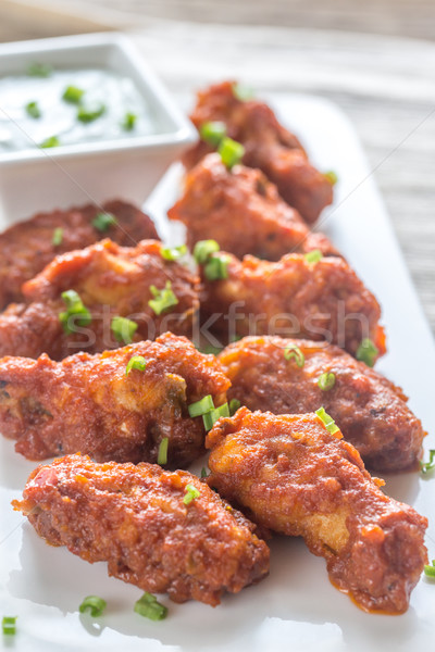 Stock photo: Fried chicken wings with blue cheese sauce
