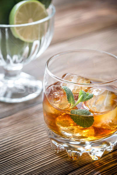 Glass of rum on the wooden background Stock photo © Alex9500