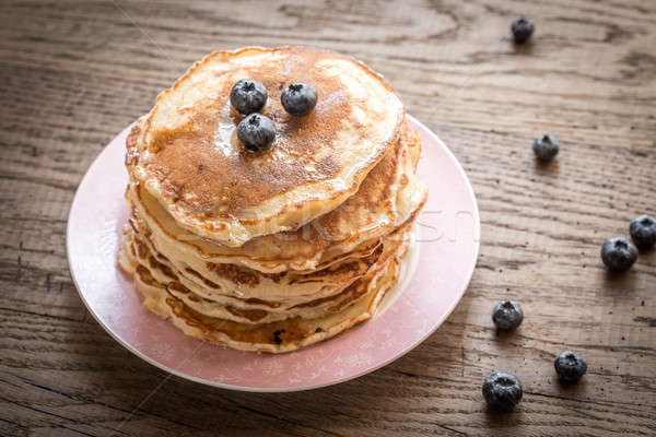 Pancakes with maple syrup and fresh blueberries Stock photo © Alex9500