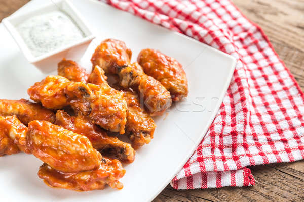 Portion of buffalo chicken wings Stock photo © Alex9500