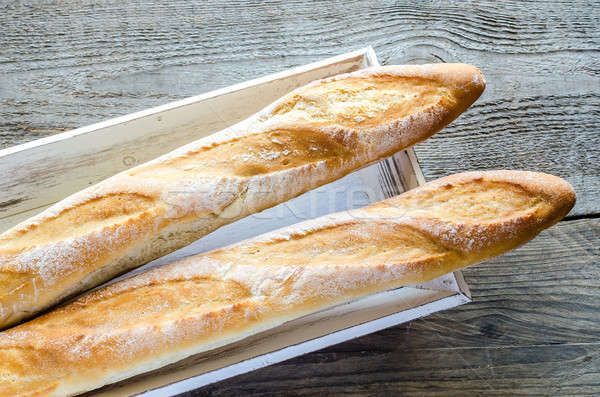 Stock photo: Two baguettes on the wooden tray