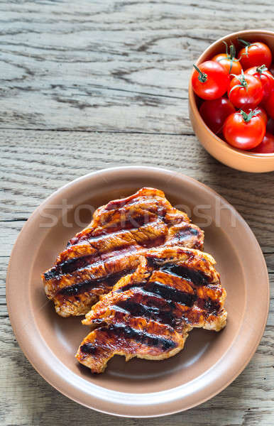 Grilled pork steaks on the plate Stock photo © Alex9500