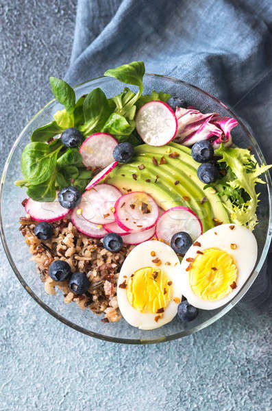 Bowl of wild rice with avocado, egg and lettuce Stock photo © Alex9500