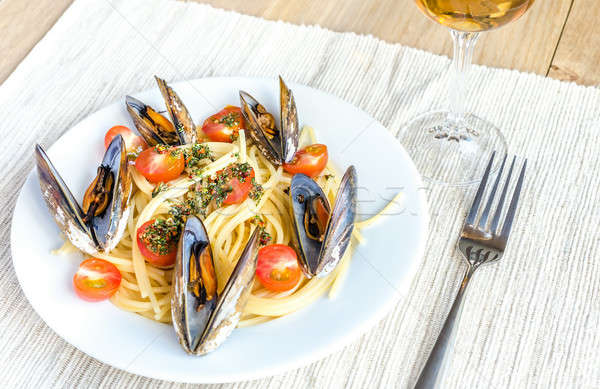 Spaghetti with mussels and cherry tomatoes Stock photo © Alex9500