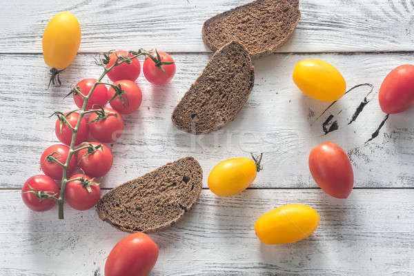 Fresh tomatoes with slices of dark-rye bread Stock photo © Alex9500