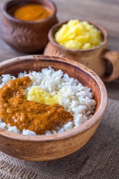 Bowl of rice with Indian butter sauce and Ghee clarified butter Stock photo © Alex9500