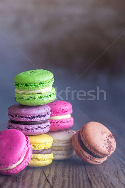 Colorful macarons on the wooden background Stock photo © Alex9500