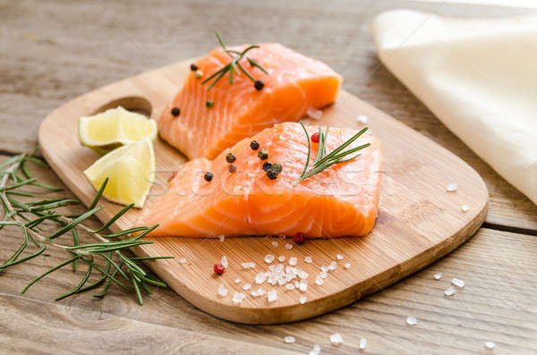 Raw salmon steaks on the wooden board Stock photo © Alex9500