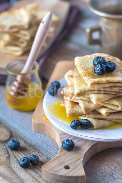 Crepes with fresh blueberries and honey Stock photo © Alex9500