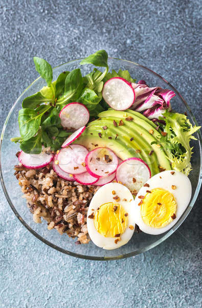 Bowl of wild rice with avocado, egg and lettuce Stock photo © Alex9500