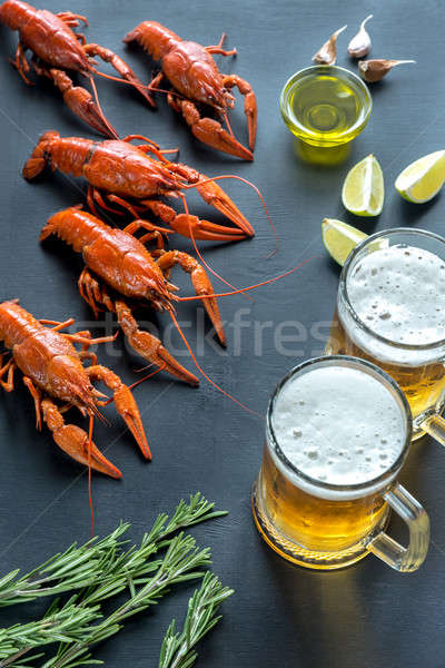 Boiled crayfish with two mugs of beer Stock photo © Alex9500