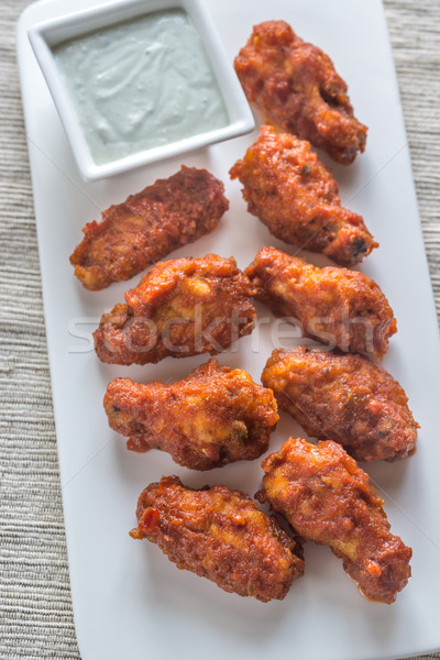 Fried chicken wings with blue cheese sauce Stock photo © Alex9500