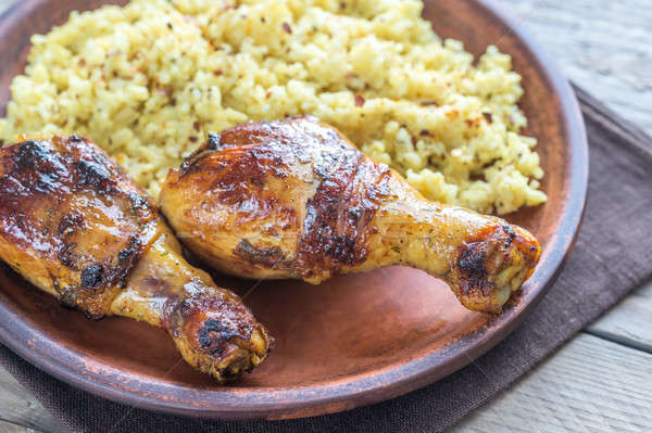 Spicy chicken drumsticks with rice curry Stock photo © Alex9500