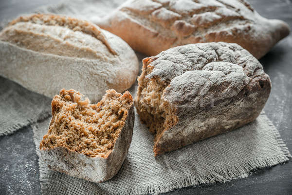 Stock photo: Whole grain breads on the dark wooden background