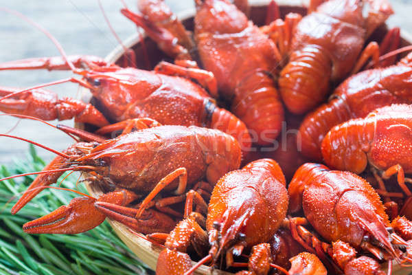 Bowl of boiled crayfish on the wooden table Stock photo © Alex9500