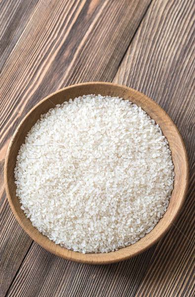 Bowl of uncooked camolino rice Stock photo © Alex9500