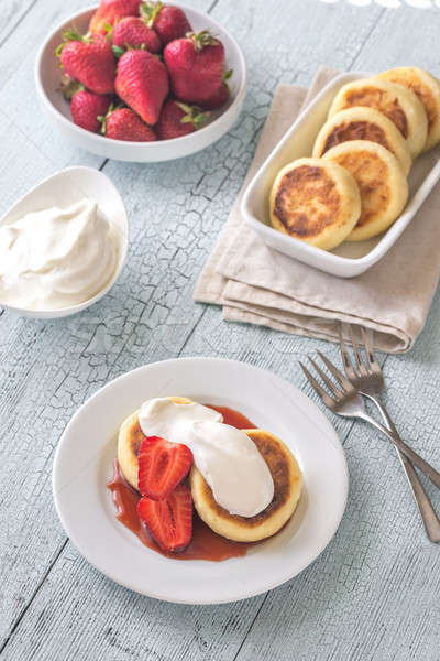 Cottage cheese patties with whipped cream Stock photo © Alex9500