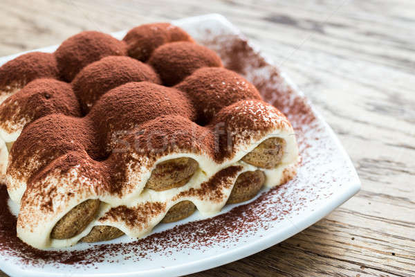 Tiramisu on the plate on the wooden background Stock photo © Alex9500