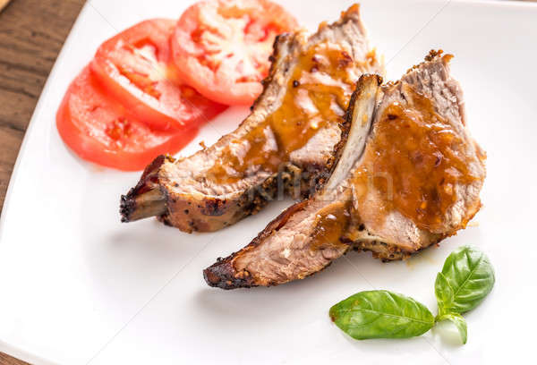 Portion of grilled pork ribs in barbecue sauce Stock photo © Alex9500