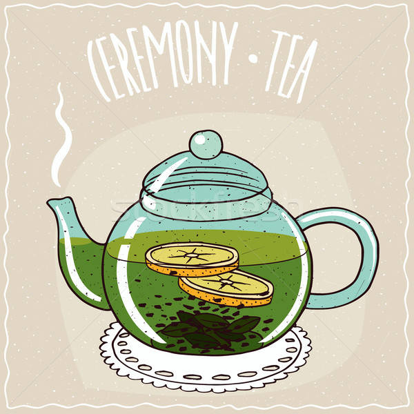 Glass teapot with green tea with lemon Stock photo © alexanderandariadna