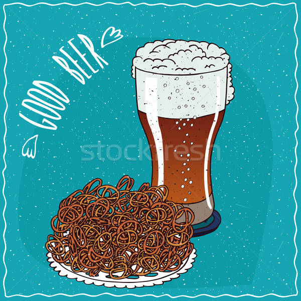 Pile of pretzels with glass of beer Stock photo © alexanderandariadna