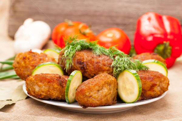 Fried cutlet with  cucumber and dill on a plate Stock photo © alexandkz
