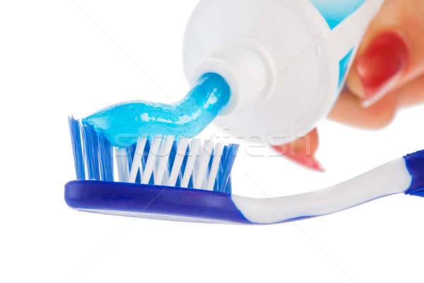 Tooth brush with tooth paste on white background Stock photo © alexandkz