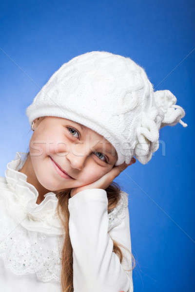 Portrait of an adorable baby girl wearing a knit  white winter hat.  Stock photo © alexandkz