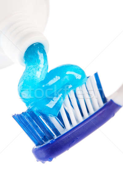 Tooth brush with tooth paste on white background Stock photo © alexandkz