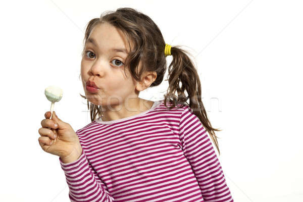 Bambina bianco primo piano lollipop isolato mano Foto d'archivio © alexandre_zveiger