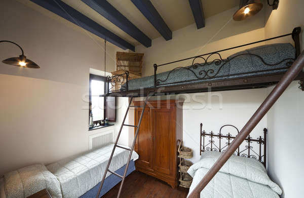 Three beds room with wrought iron staircase Stock photo © alexandre_zveiger