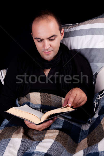 Hombre sofá lectura libro aislado negro Foto stock © alexandrenunes