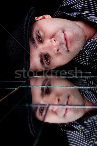 handsome man, with reflexion of the face on the mirror Stock photo © alexandrenunes