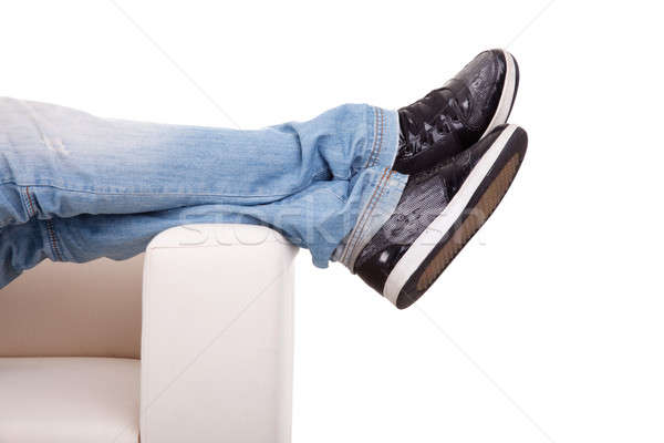 Detail, of some legs stretched on the couch Stock photo © alexandrenunes