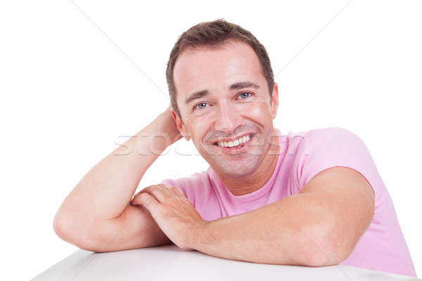 Portrait of a handsome middle-age man smiling, on white background. Studio shot Stock photo © alexandrenunes