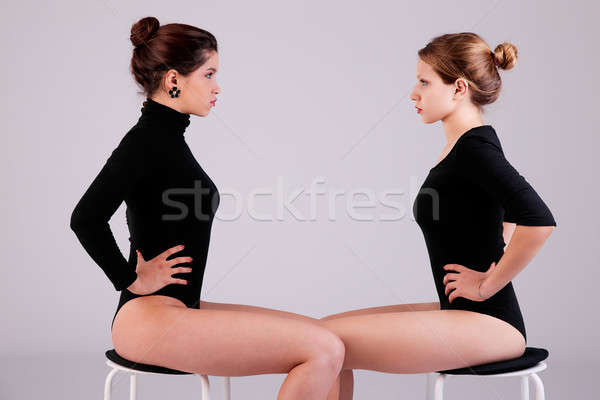 two beautiful women, sitting on a bench, face to face Stock photo © alexandrenunes