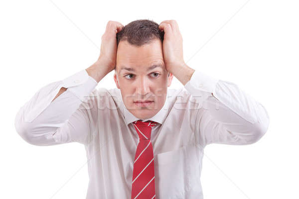 Strongly afflicted business man, with hands on head, isolated on white Stock photo © alexandrenunes
