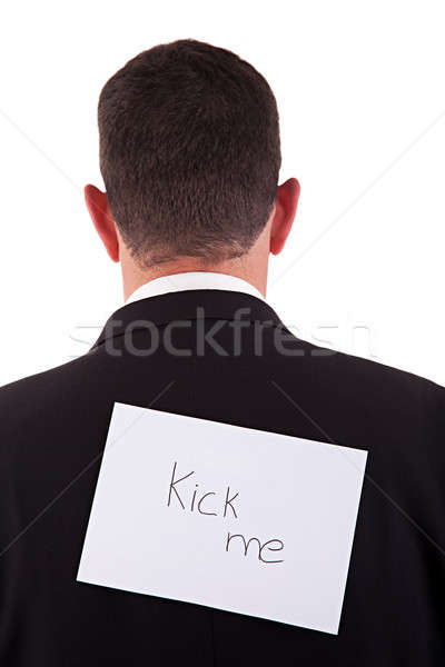 back of businessman, with kick me written in a paper Stock photo © alexandrenunes