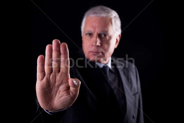 old businessman with his hand raised in signal to stop Stock photo © alexandrenunes