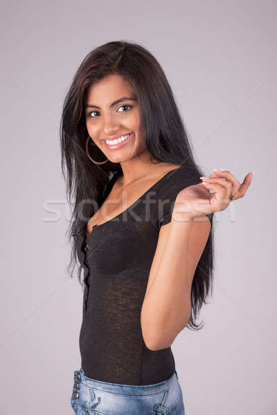 Happy and beautiful latin woman, looking to camera, studio shot Stock photo © alexandrenunes