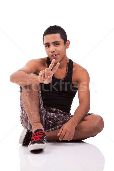 Jungen Mann Sitzung Stock Daumen angehoben Stock foto © alexandrenunes