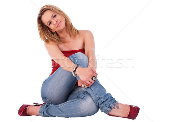beautiful and elegant middle-age woman, seated on floor Stock photo © alexandrenunes