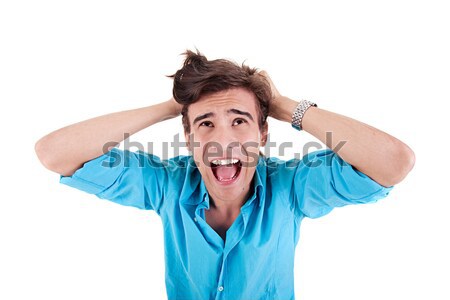 Strongly afflicted young man, screaming and pulling hair Stock photo © alexandrenunes
