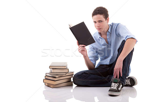 [[stock_photo]]: Cute · garçon · lecture · livre · étage · isolé