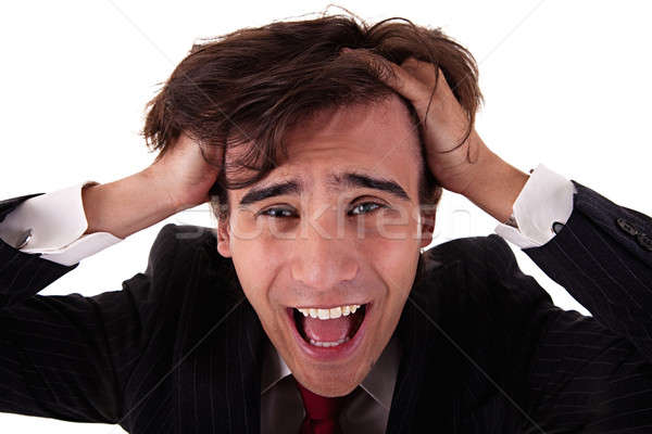 Strongly afflicted young businessman keeps hands for head Stock photo © alexandrenunes