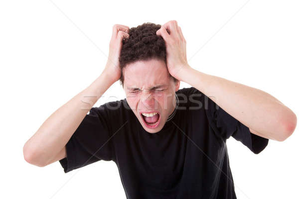 Strongly afflicted young man, screaming and pulling hair Stock photo © alexandrenunes