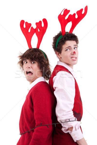 happy young men wearing reindeer horns, arrested in Christmas lights Stock photo © alexandrenunes