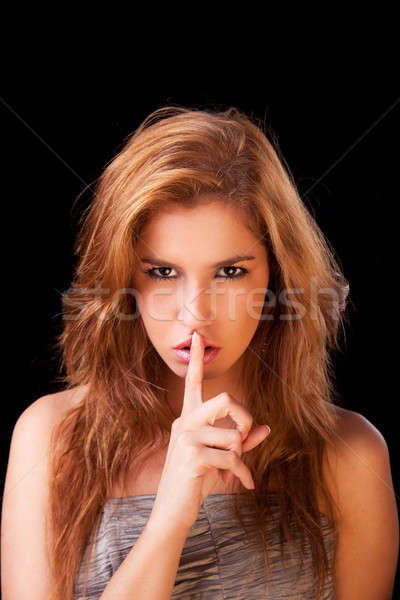 Young woman asking for silence , with golden reflexion Stock photo © alexandrenunes