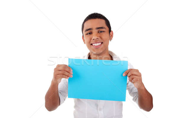 Stock photo: young latin man, with blue card in hand, smiling